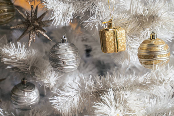 istock Christmas concept. Christmas decoration on the Christmas tree- white, silver and golden elements. Home decoration. 1290999851