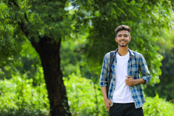 istock cheerful young man standing outdoors 1291001217