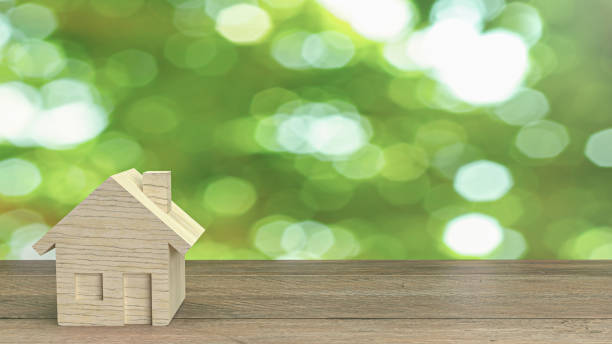 istock The wood home  on wood table for building content 3d rendering. 1291002938