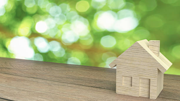 istock The wood home  on wood table for building content 3d rendering. 1291002958