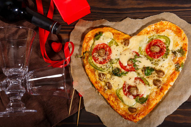 istock Pizza in the shape of a heart and wine 1291003199