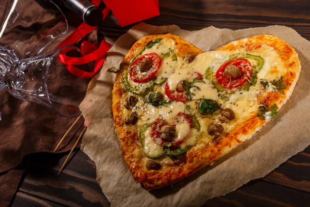 istock Pizza in the shape of a heart and wine 1291003285