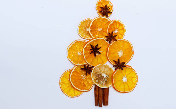 istock Edible new years tree from dried orange, cinnamon and anise star. 1291008420