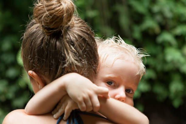 istock Happy young mother hold on hands baby son. 1291009546