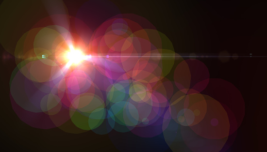 Abstract digital lens flare with black background.Sunlight effect.Sparkle bokeh background