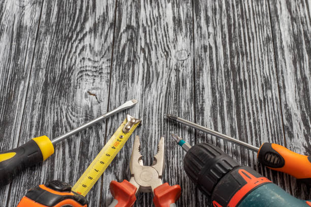 istock Set of tools on a black wooden table. 1291013739