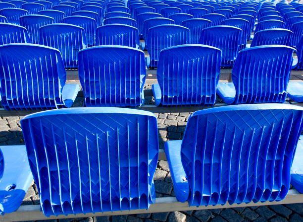 istock Blue chairs are placed on a row in an auditorium 1291030865