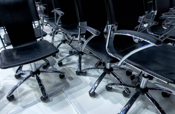 istock Blue chairs are placed on a row in an auditorium 1291030915