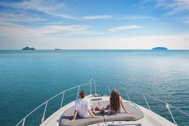 luxury cruise travel on the yacht, romantic honeymoon vacation for couple luxury cruise travel on the yacht, romantic honeymoon vacation for two on the sea beach wealthy lifestyle stock pictures, royalty-free photos & images