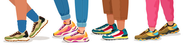 Feet in sneakers. Female and male walking legs in sport shoes with socks, pants and jeans. Trendy fashion fitness footwear vector concept Feet in sneakers. Female and male walking legs in sport shoes with socks, pants and jeans. Trendy fashion fitness footwear vector concept. Colorful comfortable trainers on young people someone walking sneakers stock illustrations