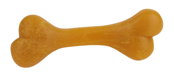 istock Dog bone orange pet toy perfect isolated on white background 1291035541