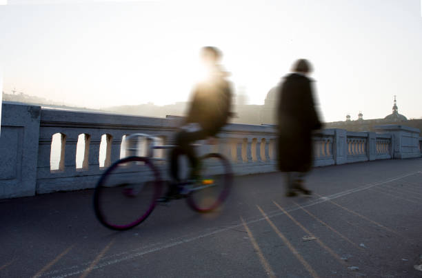 istock A bicycle and a passerby on the Wilson bridge in Lyon 1291036370