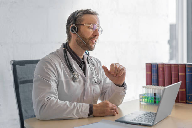 istock Middle aged doctor during an online consultation with a patient 1291039329