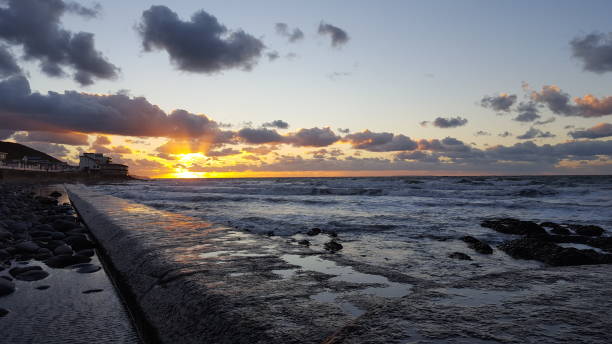 istock Westward Ho! sunset over the sea 1291039500