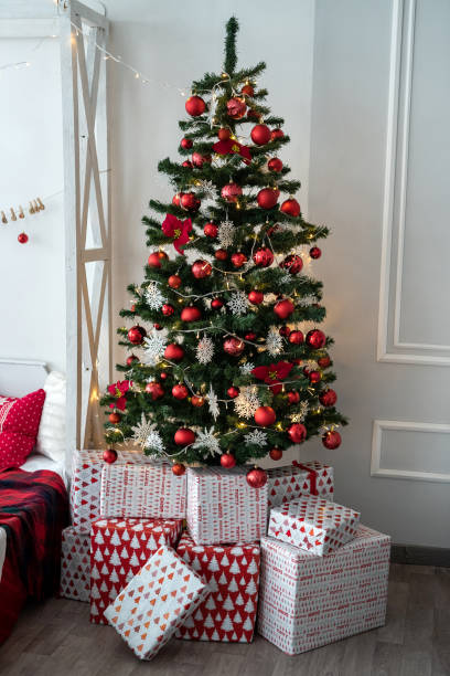 istock gift boxes under fir tree for Christmas or New Year 1291040736
