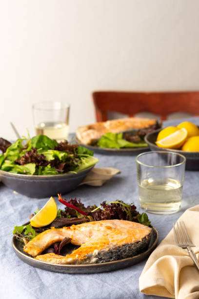 istock Fried salmon steak with salad 1291041874