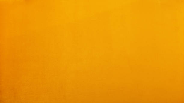 istock Warm yellow soft velvet textile background 1291043346