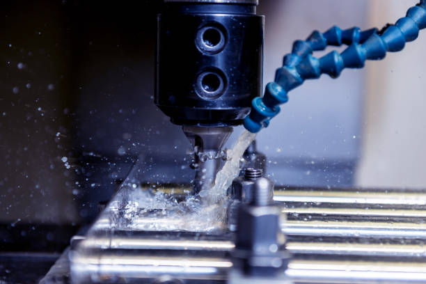 istock CNC milling machine drills holes in the pipe. 1291045413
