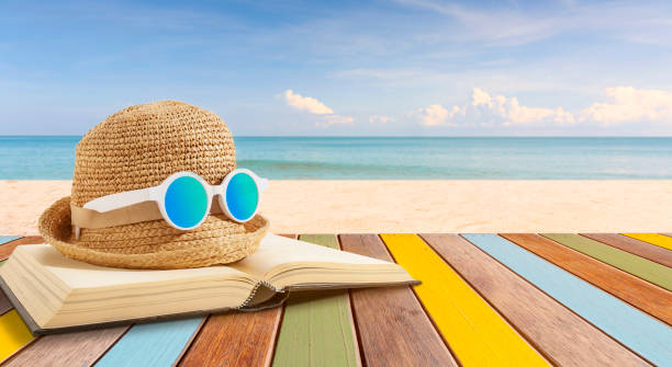 Books and sunglasses on a beach