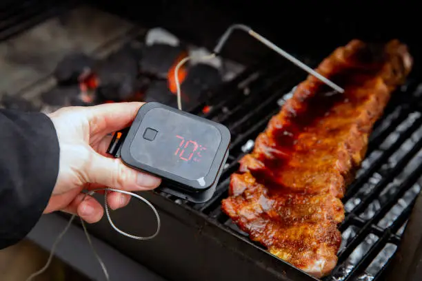 Photo of Digital Thermometer BBQ, grill, barbecue for beaf steak and spare rib ant other meat. measuring temperature