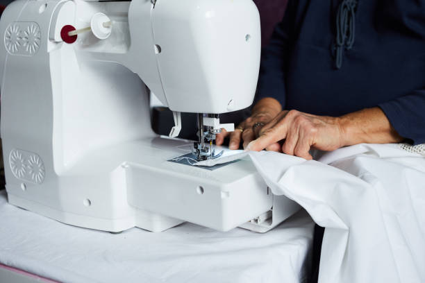 istock Housewife working with sewing machine 1291048204