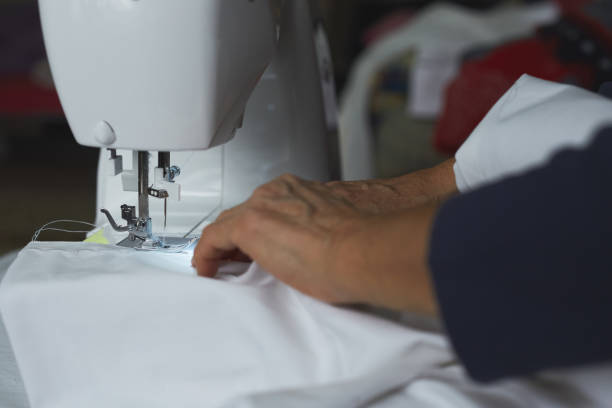 istock Housewife working with sewing machine 1291048944