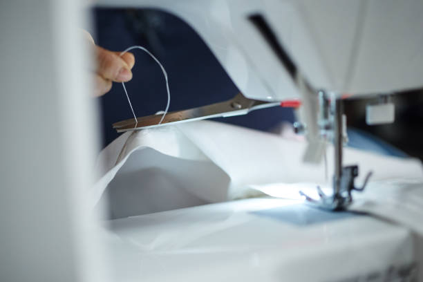 Housewife working with sewing machine