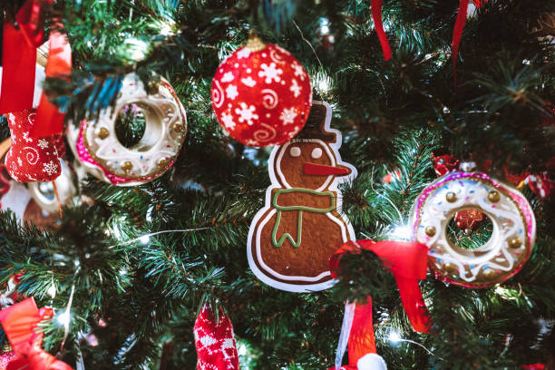 istock Snowman donuts toys hanging on the Christmas tree 1291049026