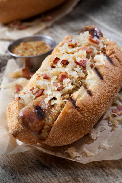 istock Grilled Bratwurst with Fried Sauerkraut and Crispy Bacon 1291049268