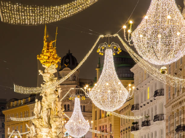 istock Plague Column on illuminated Graben Street during night in Vienna, Austria. 1291052395