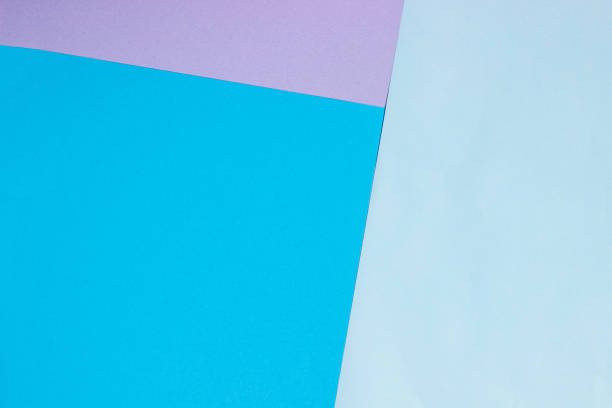 istock Abstract geometric flat background from colored paper. Violet and blue colored paper, template for adding text. 1291052424