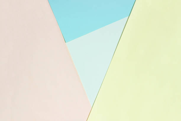 istock Abstract geometric flat background from colored paper. Yellow and blue colored paper, a template for adding text. 1291052438
