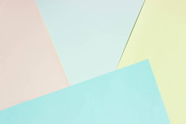 istock Abstract geometric flat background from colored paper. Yellow and blue colored paper, a template for adding text. 1291052441