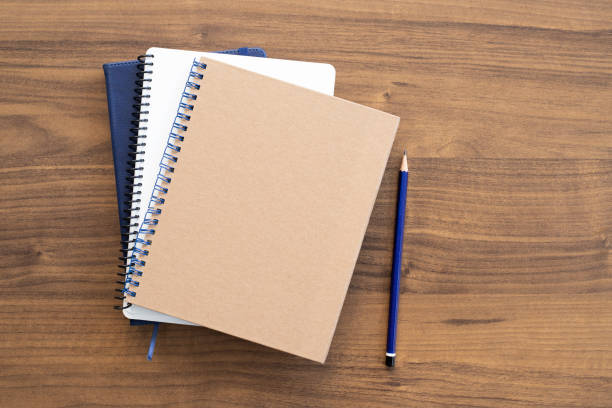 istock Blank vintage paper notebook with pencil 1291052478