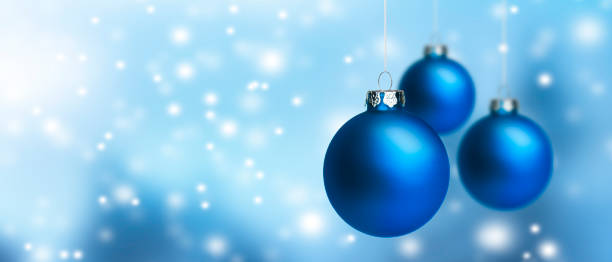 istock Blue Christmas balls against a blurred background 1291052923