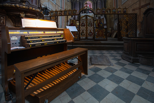 Komarno, Ukraine - October 8, 2020:  Interior of Roman Catholic Church of Nativity of the Blessed Virgin Mary in Komarno, Lviv region, Ukraine. Modern organ console