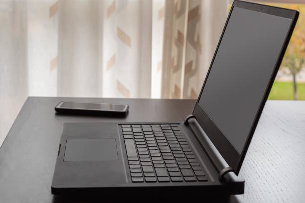 istock laptop and mobile phone on a table ready to work from home and use new technologies and social networks 1291055576
