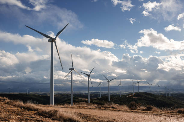 istock Wind turbines against cloudy sky in Navarre, Spain. 1291060170