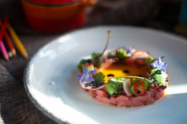 istock Tuna Tartar with Avocado on white plate, molecular Haute cuisine 1291060368