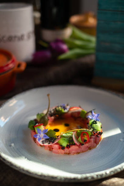 istock Tuna Tartar with Avocado on white plate, molecular Haute cuisine 1291060374