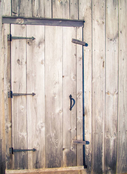 istock wooden door on a barn 1291062853