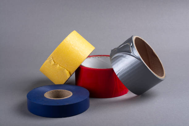istock Several rolls of duct tape on a gray background. 1291065457