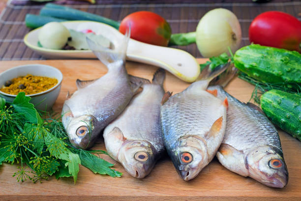 istock Fish and components for her preparation: vegetables, spices, parsley. 1291066386