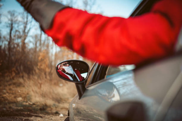istock Santa Claus in the rearview mirror 1291066518