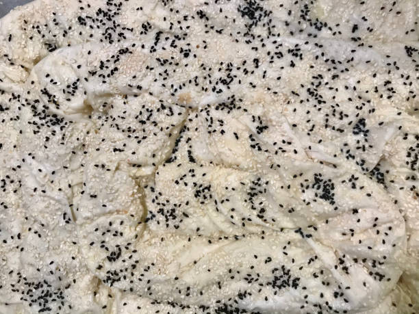 istock black cumin with sesame seeds on homemade uncooked pie 1291067612