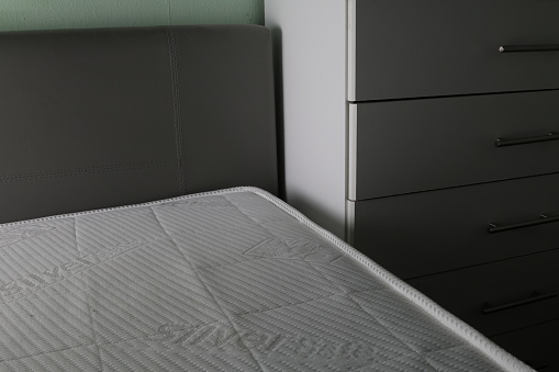 bed in a bedroom with a memory foam mattress. the mattress has silver threads and is antibacterial.