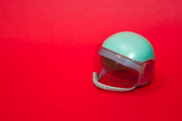 istock mint  pastel  toy plastic motorcycle helmet on pink background 1291069141