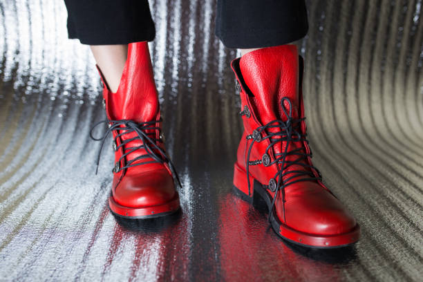 istock Red women's autumn boots close-up 1291069172