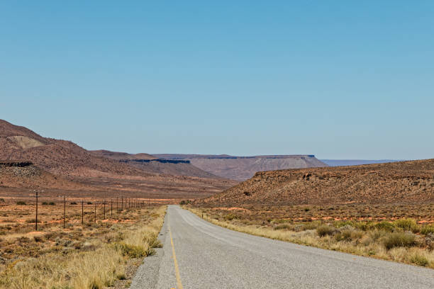 Straight road through flat topped hills in Nama Karoo, Northern Cape, South Africa