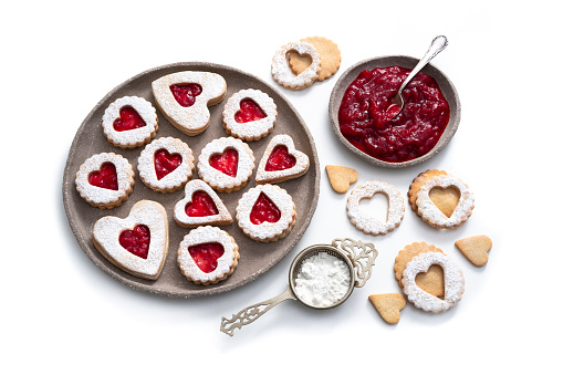 Linzer cookies biscuits heart shape with strawberry jam homemade Bakery heart shape isolated on white background
